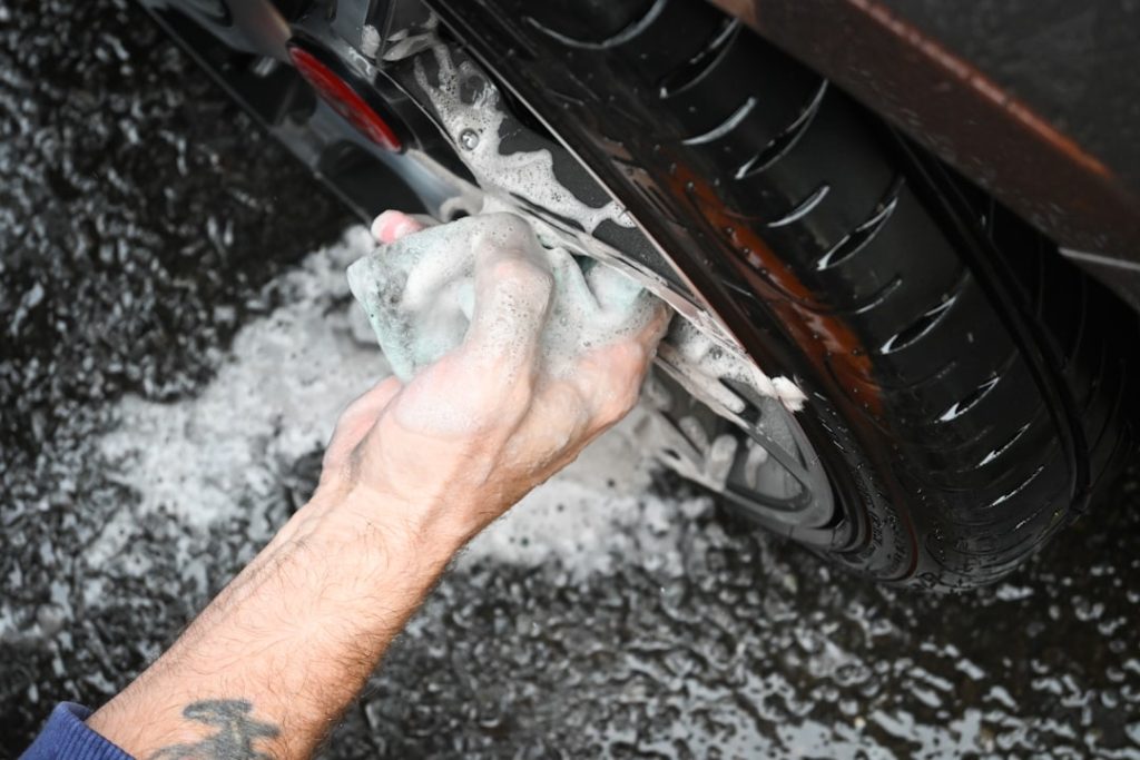 A series of shots of individual car parts being washed using Auto Lucent car products.